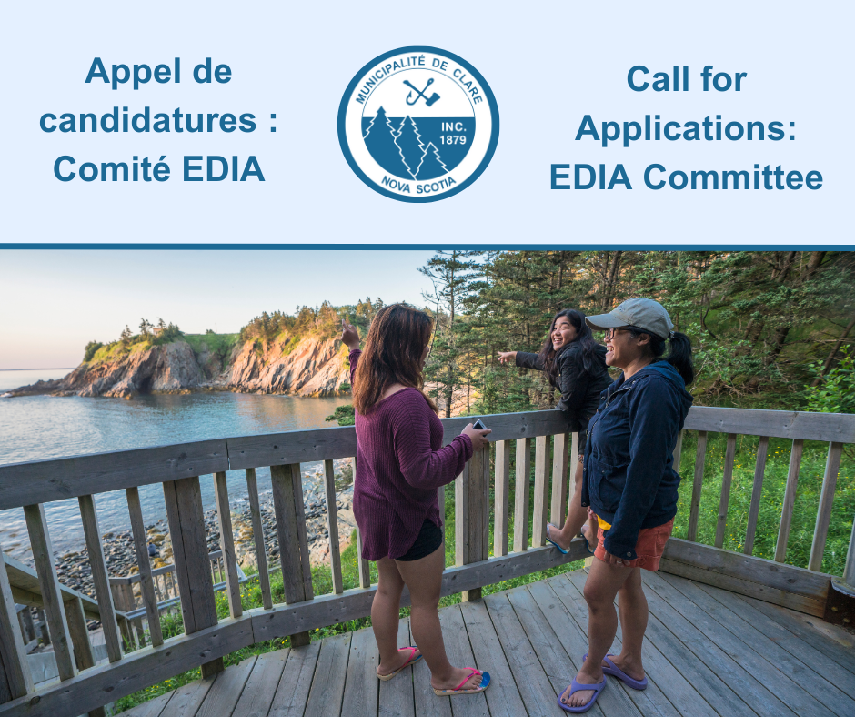 A picture of three people standing on a deck overlooking Smuggler's Cove.